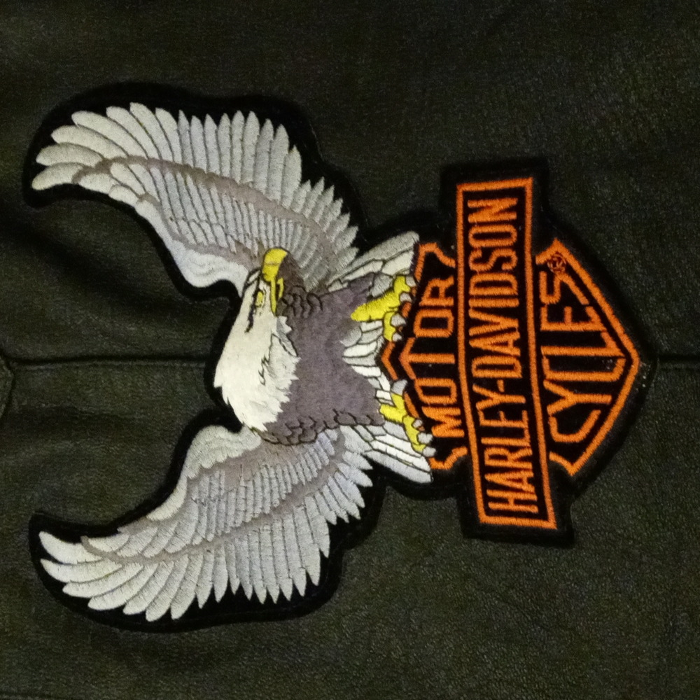 Used genuine leather vest. size 38. 4 different Harley Davidson patches sewed on
